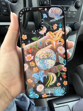 Casetify Black Clear Case with Multi-Color Floral Disco Design for Iphone 16